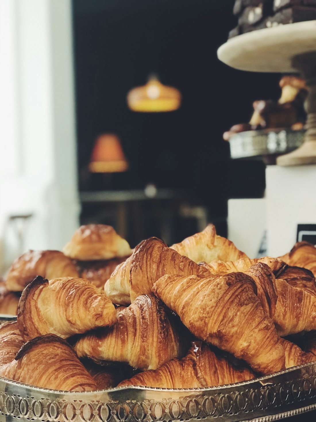 The morning tray, croissants stacked high