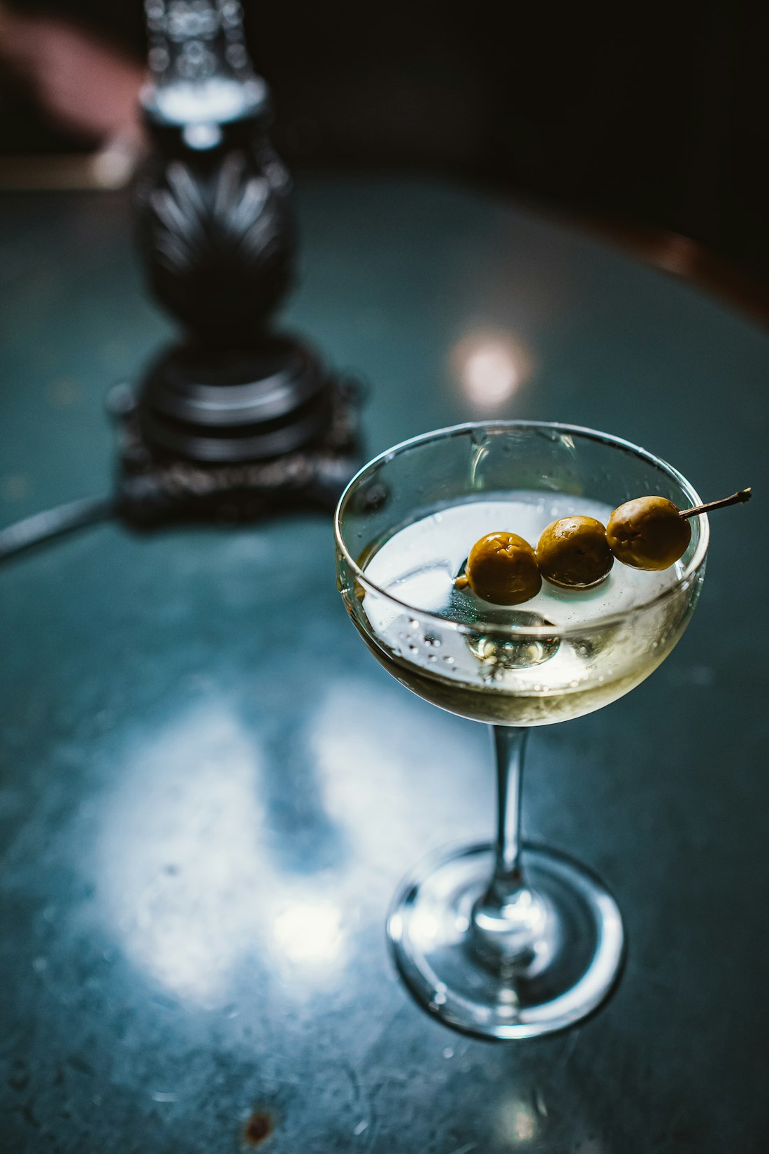 Fifty-Fifty Martini — Stirred silk, three olives