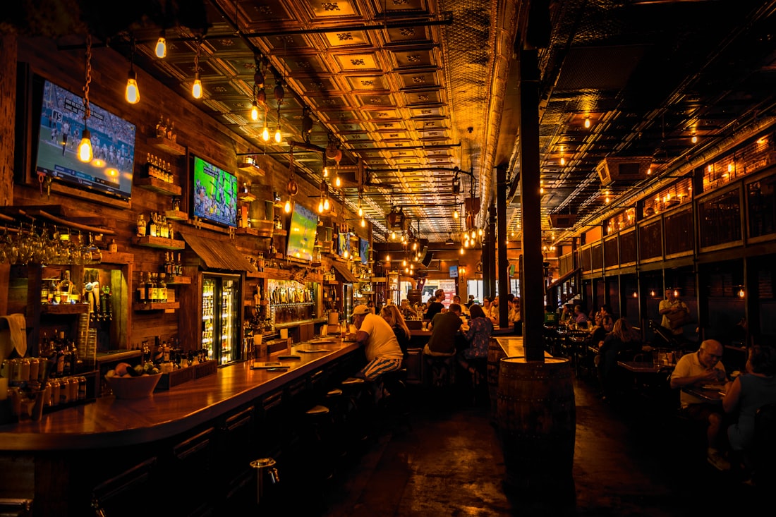 The taproom on game day, every screen lit