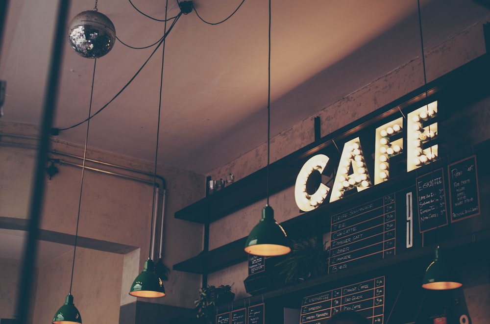 The room — lamps, shelves and the CAFE sign